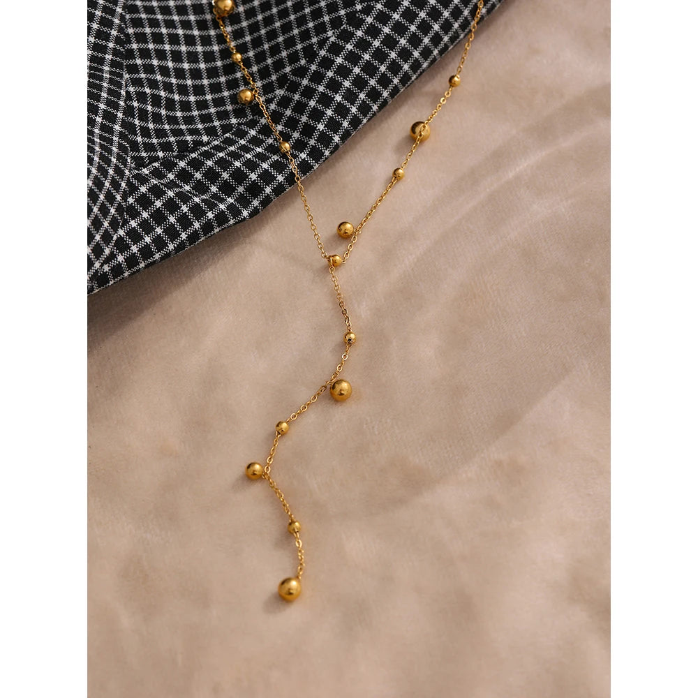 Beaded necklace in gold-plated stainless steel.
