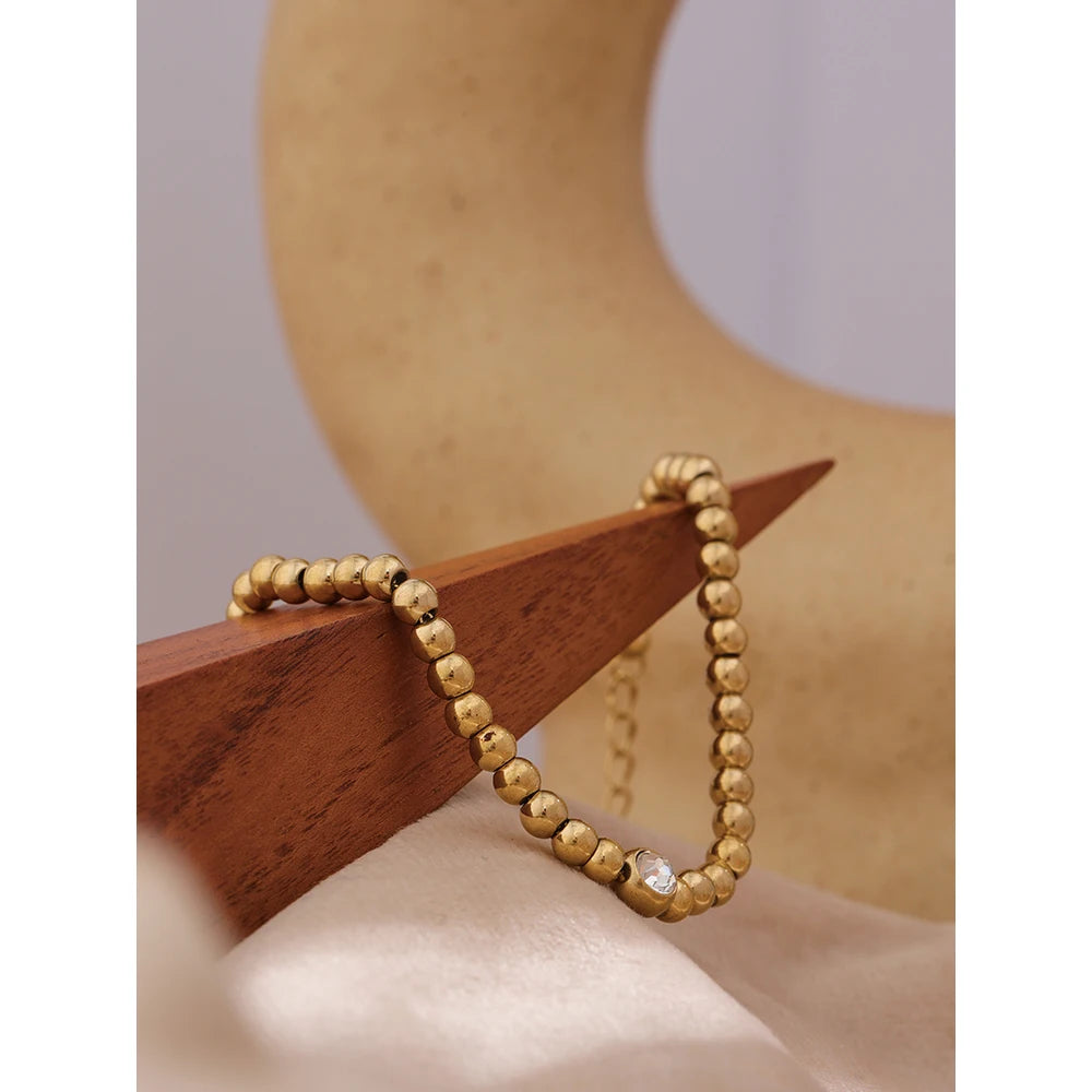 Cubic Zirconia Beaded Geometric Bracelet — Gold-Plated Stainless Steel with Cubic Zirconia · PS1573