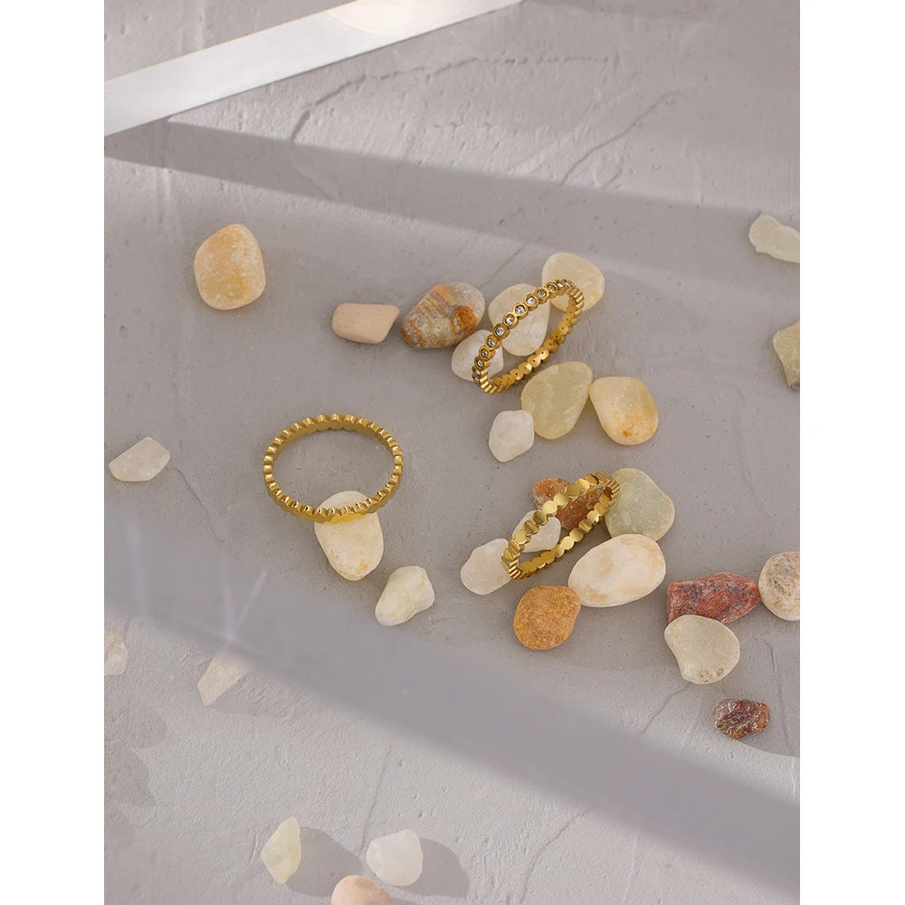Cubic zirconia geometric ring in 18K gold-plated 316L stainless steel with cubic zirconia.