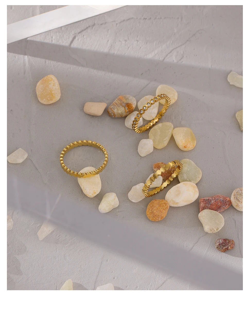 Cubic zirconia geometric ring in 18K gold-plated 316L stainless steel with cubic zirconia.