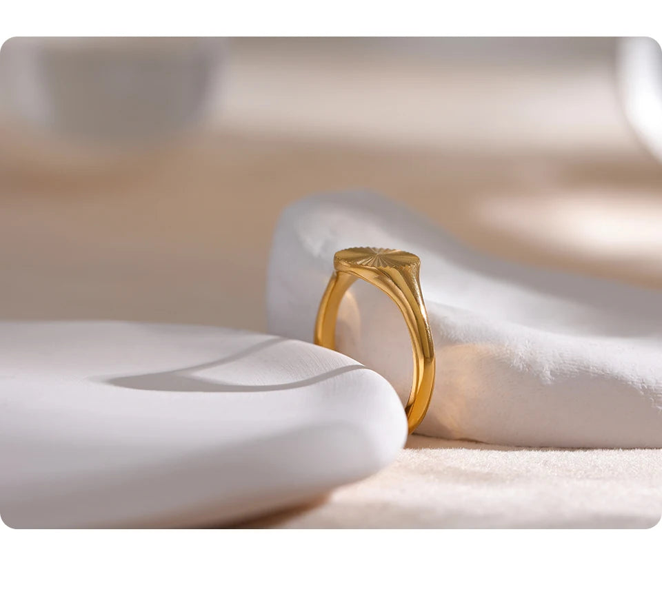 Geometric ring in gold-plated stainless steel.