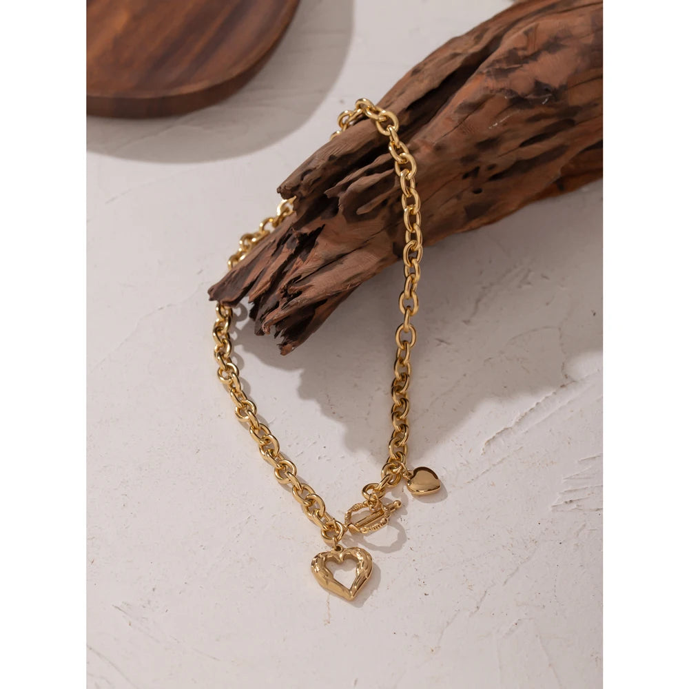 Heart hammered geometric necklace in gold-plated stainless steel.