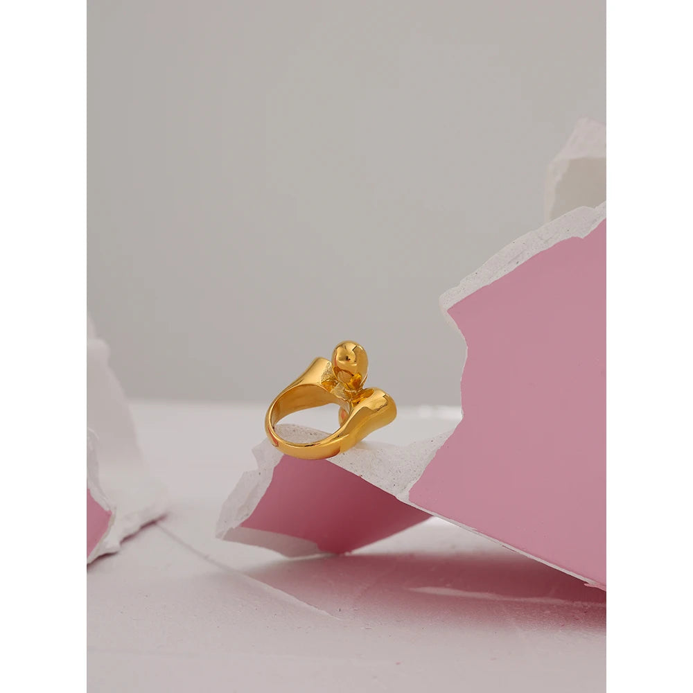 Hammered geometric ring in 18K gold-plated stainless steel.