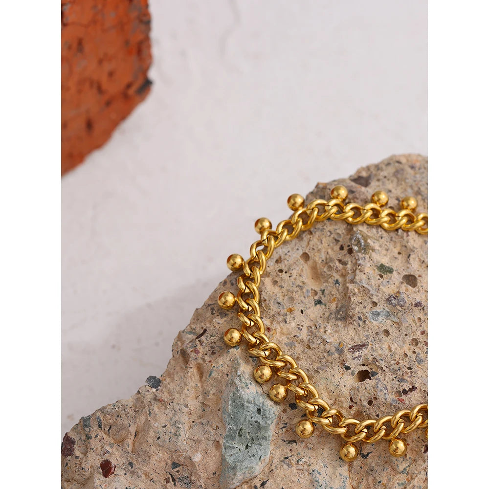 Beaded geometric chain bracelet in 18K gold-plated 316L stainless steel.
