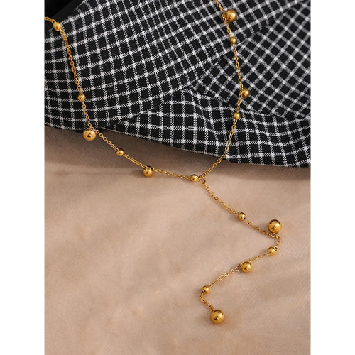 Beaded necklace in gold-plated stainless steel.