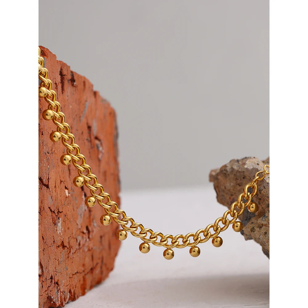 Beaded geometric chain bracelet in 18K gold-plated 316L stainless steel.