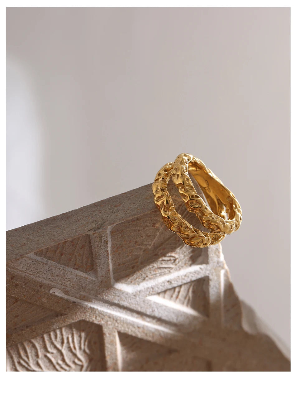 Geometric ring in 18K gold-plated stainless steel.