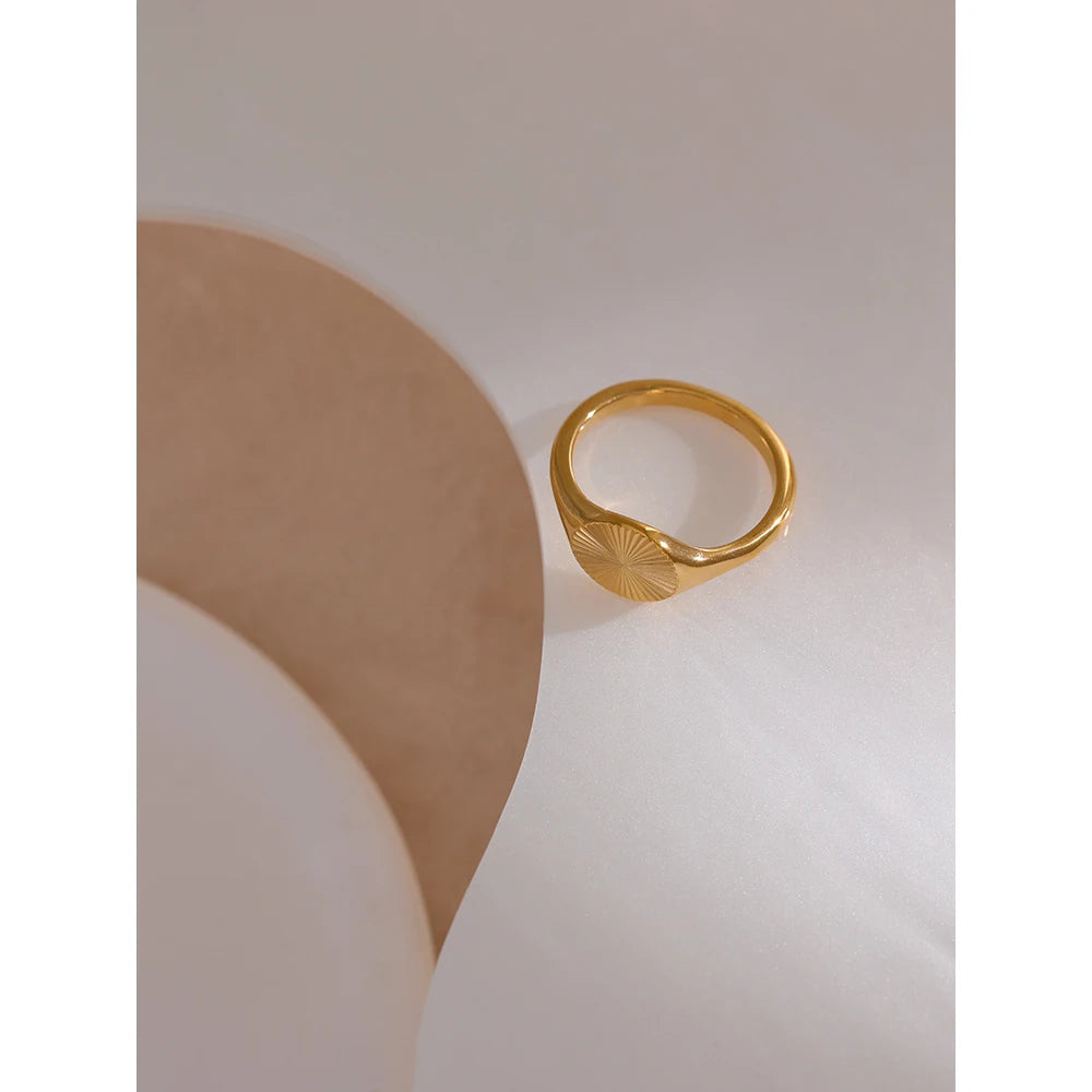 Geometric ring in gold-plated stainless steel.