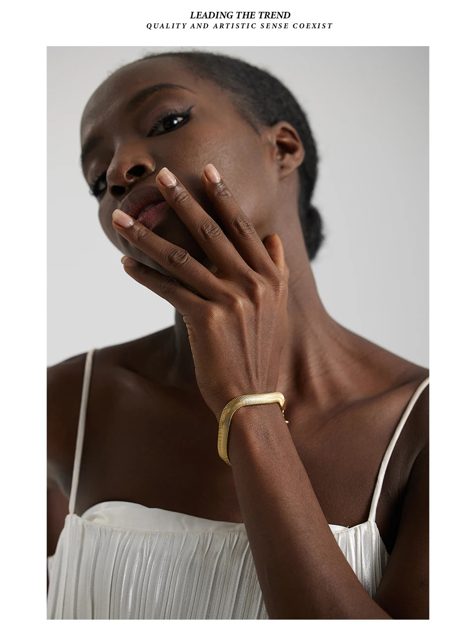 Geometric chain necklace in gold-plated stainless steel.