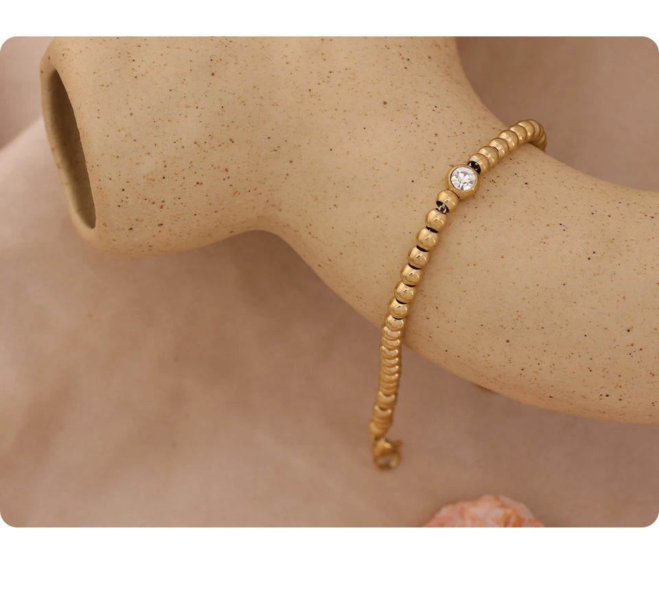 Cubic Zirconia Beaded Geometric Bracelet — Gold-Plated Stainless Steel with Cubic Zirconia · PS1573