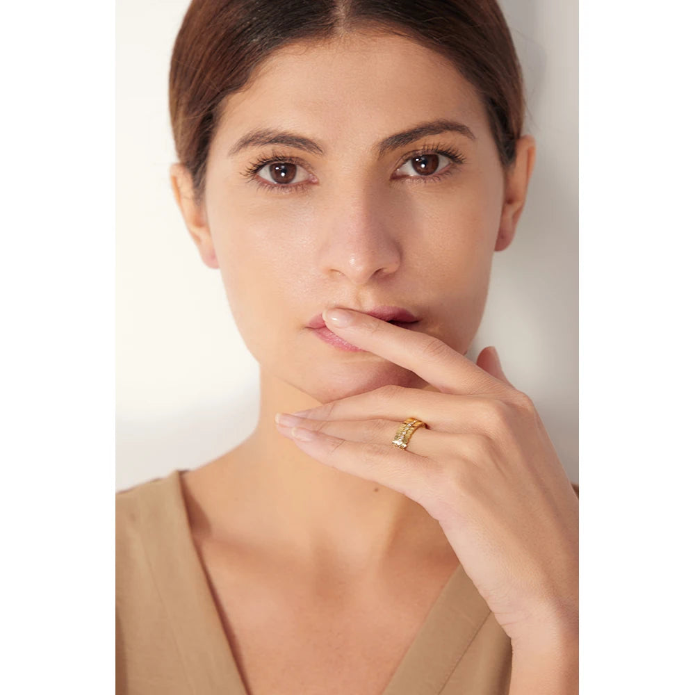 Cubic zirconia geometric ring in 18K gold-plated 316L stainless steel with cubic zirconia.