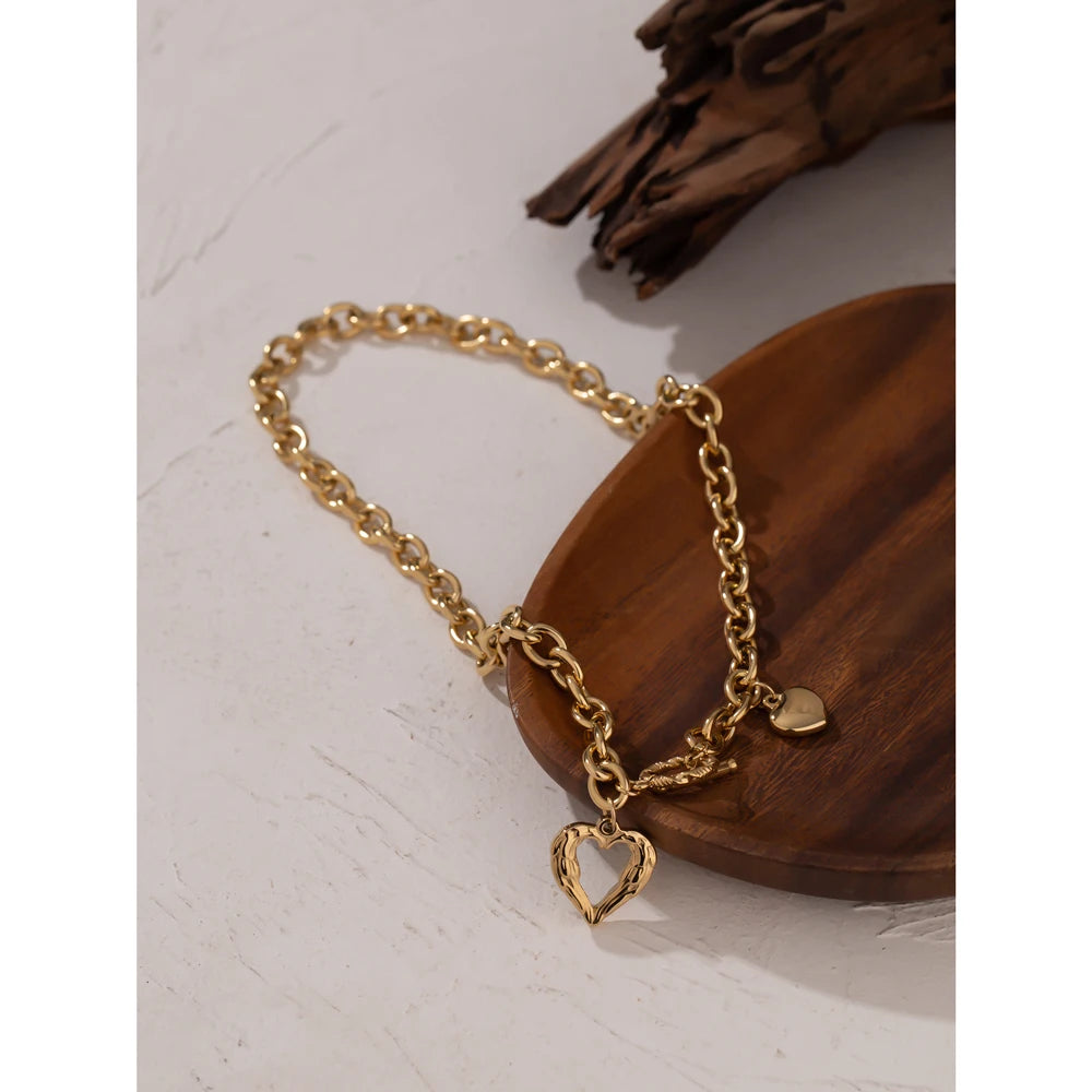 Heart hammered geometric necklace in gold-plated stainless steel.