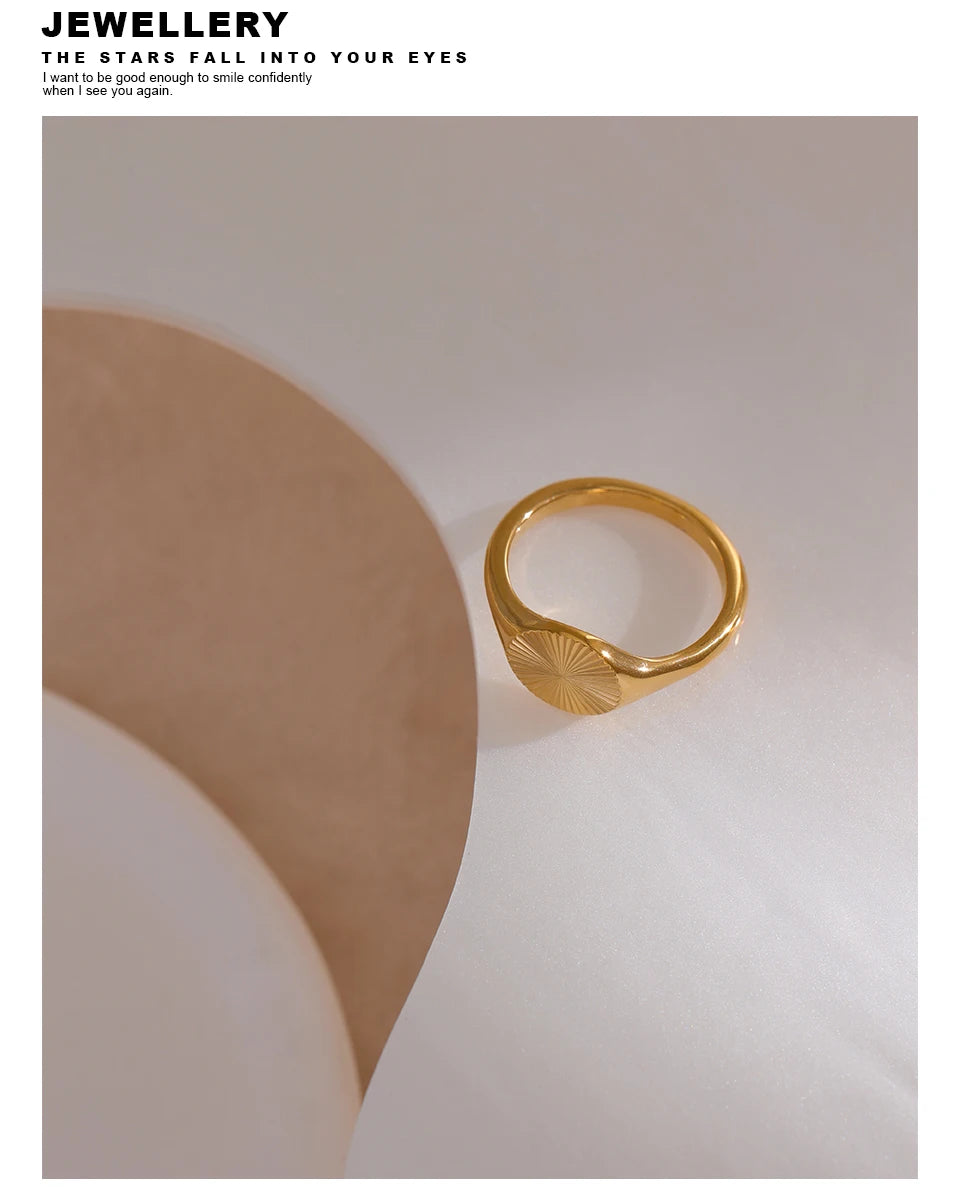 Geometric ring in gold-plated stainless steel.