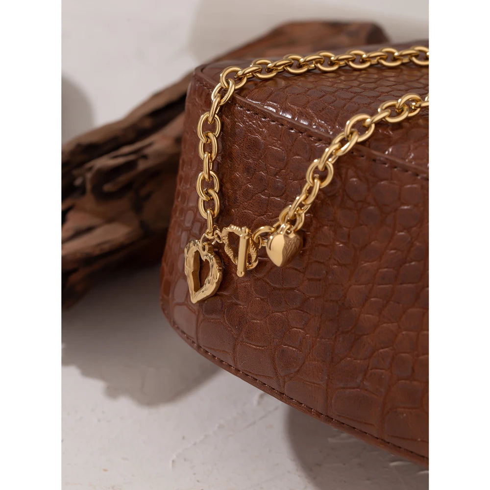 Heart hammered geometric necklace in gold-plated stainless steel.