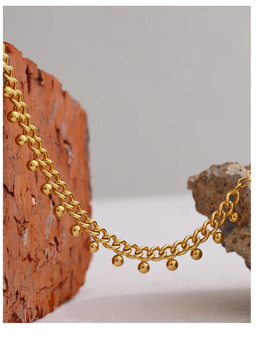 Beaded geometric chain bracelet in 18K gold-plated 316L stainless steel.