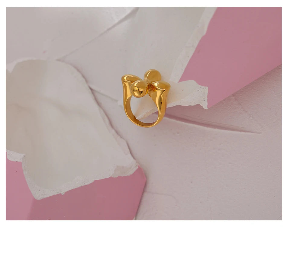 Hammered geometric ring in 18K gold-plated stainless steel.