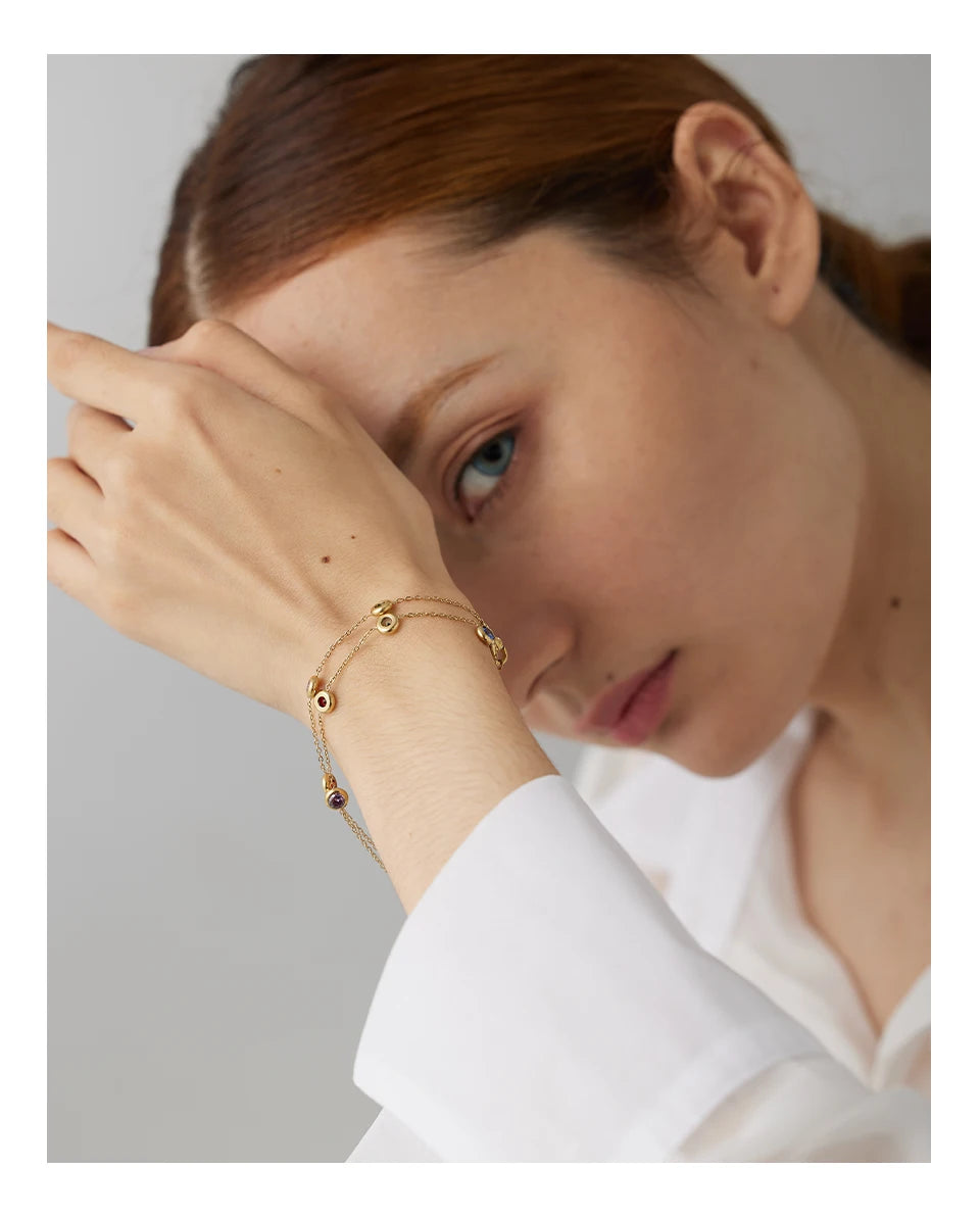 Cubic zirconia multi-color geometric necklace in gold-plated stainless steel with cubic zirconia.