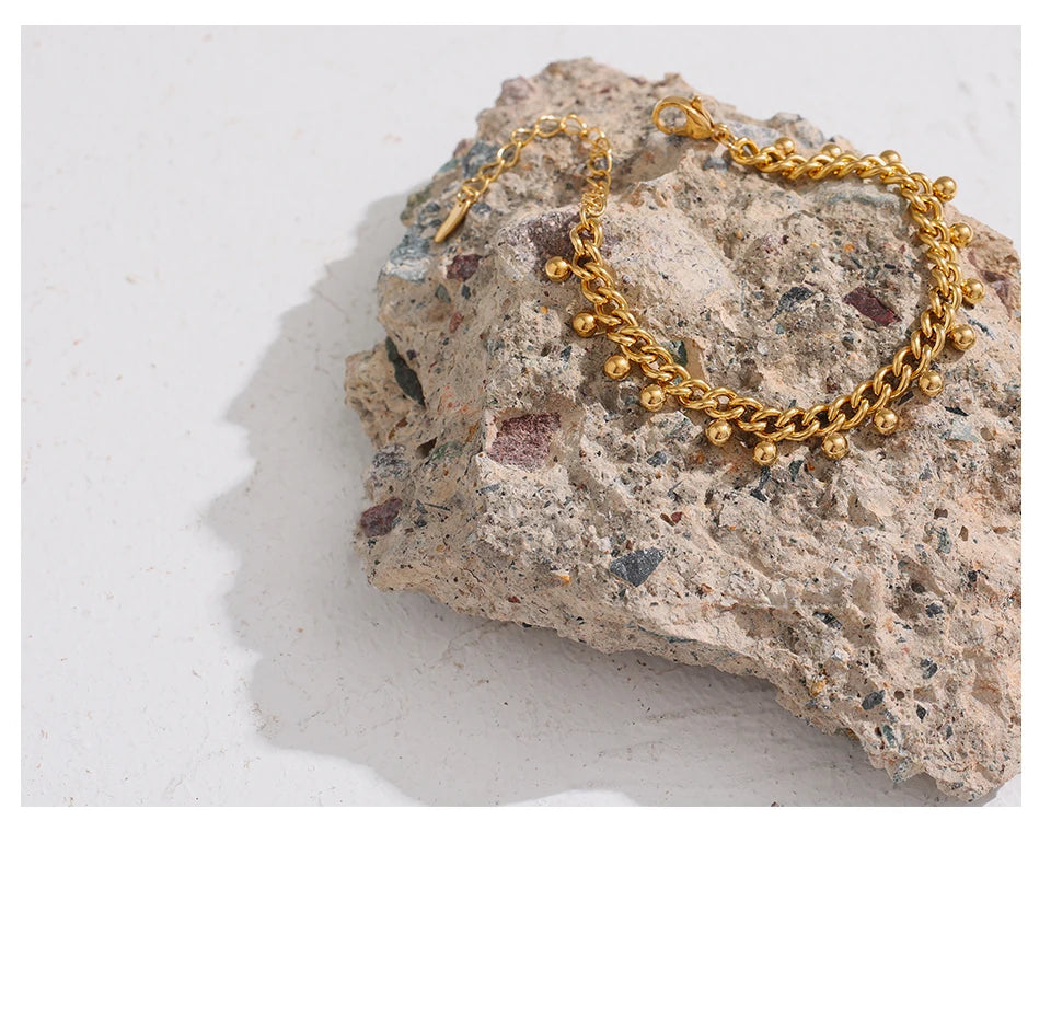Beaded geometric chain bracelet in 18K gold-plated 316L stainless steel.