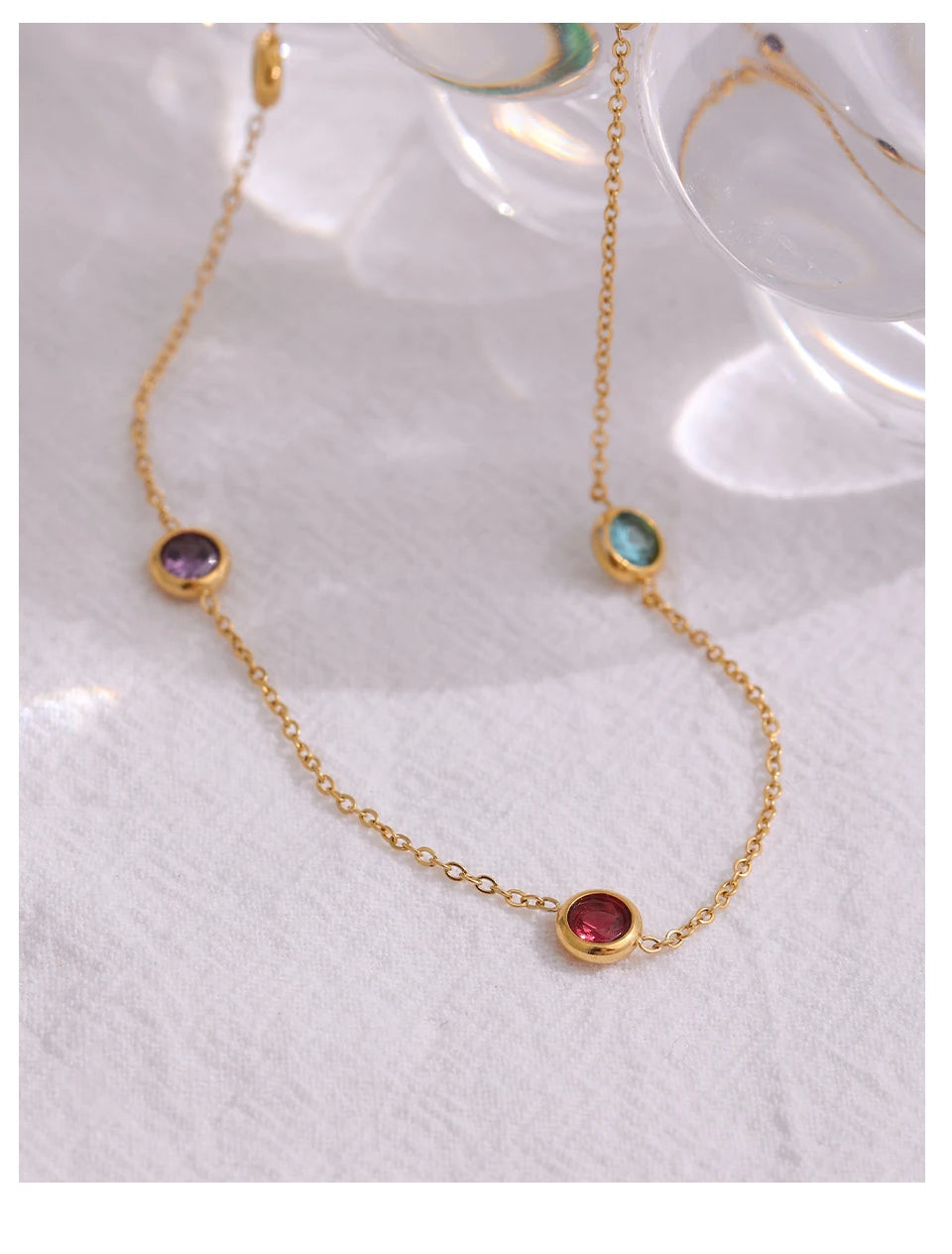 Cubic zirconia multi-color geometric necklace in gold-plated 316L stainless steel with cubic zirconia.