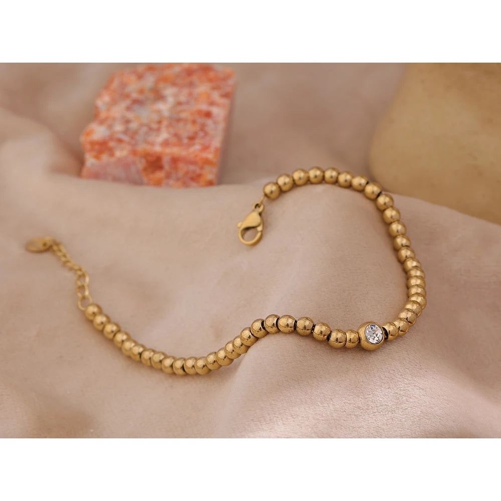 Cubic Zirconia Beaded Geometric Bracelet — Gold-Plated Stainless Steel with Cubic Zirconia · PS1573