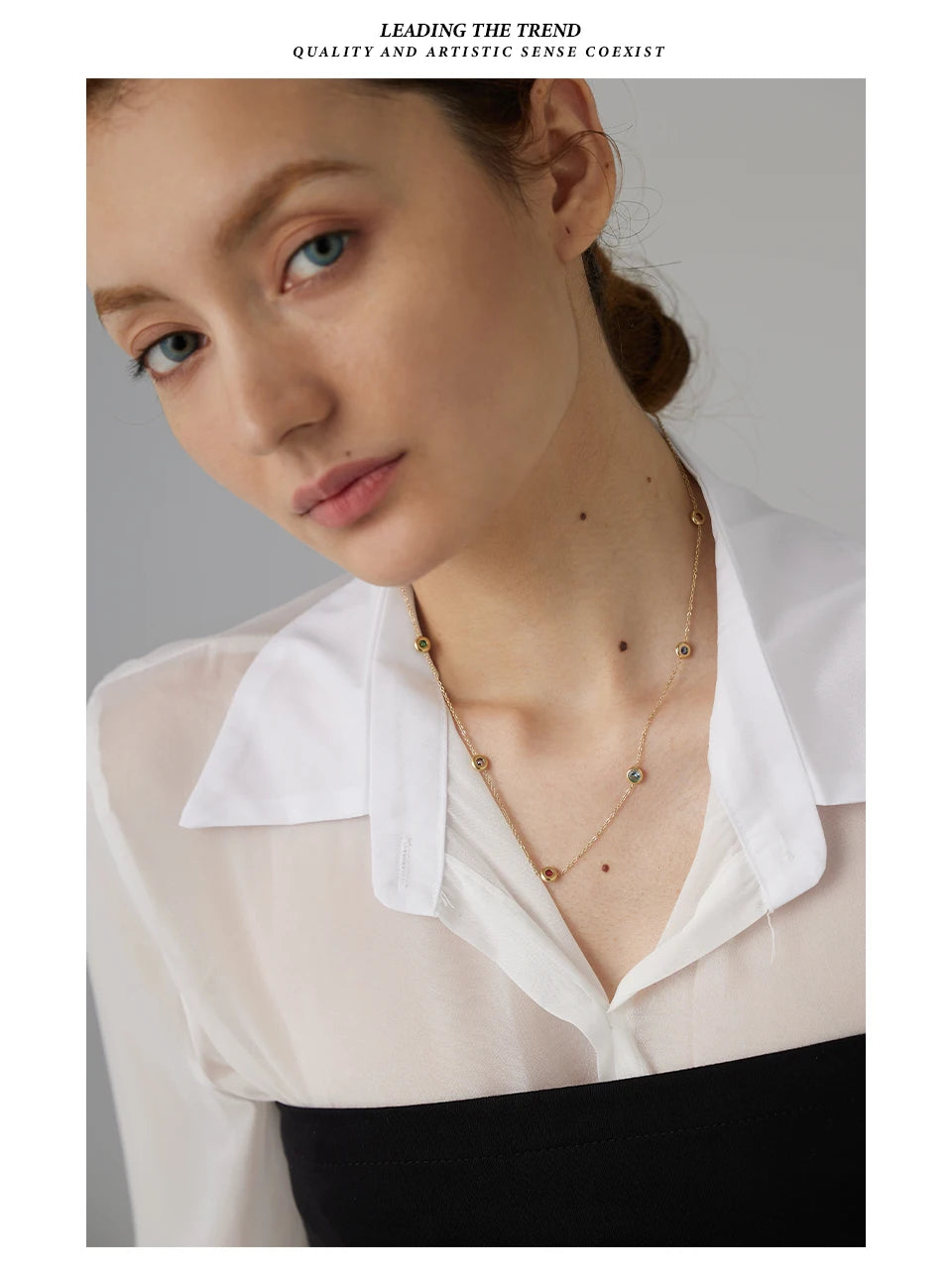 Cubic zirconia multi-color geometric necklace in gold-plated 316L stainless steel with cubic zirconia.
