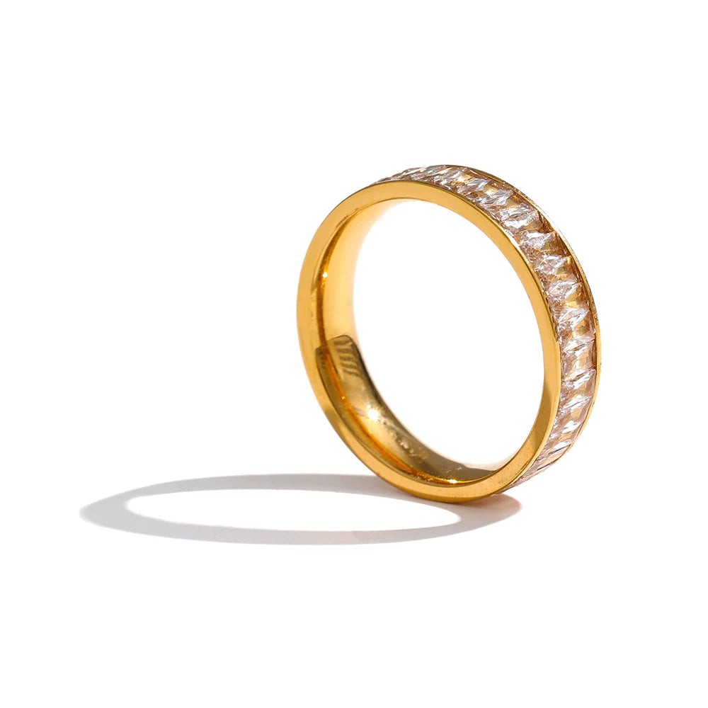 Cubic zirconia geometric ring in 18K gold-plated stainless steel with cubic zirconia.