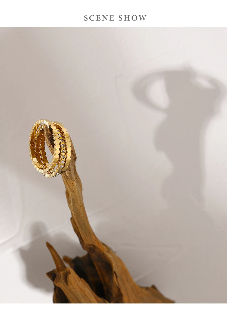 Cubic zirconia geometric ring in 18K gold-plated 316L stainless steel with cubic zirconia.