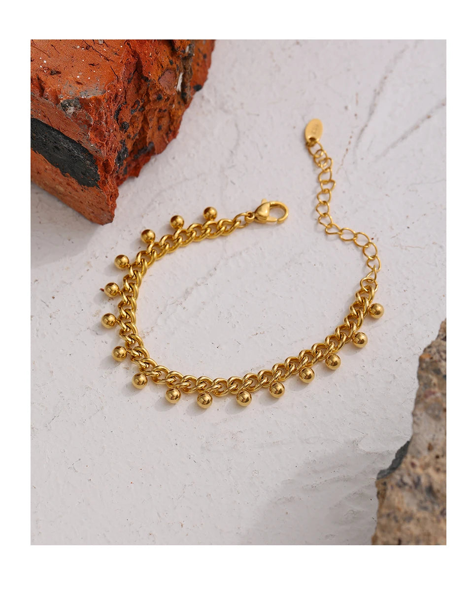 Beaded geometric chain bracelet in 18K gold-plated 316L stainless steel.