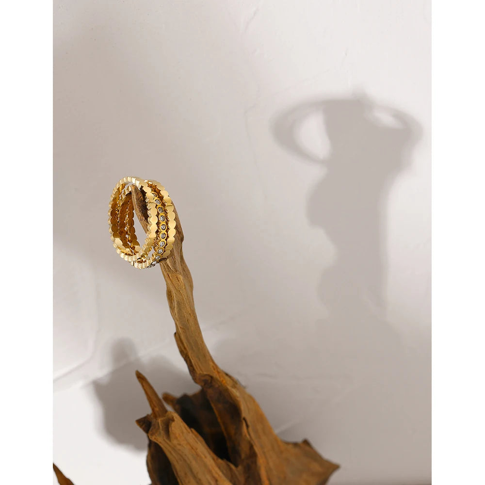 Cubic zirconia geometric ring in 18K gold-plated 316L stainless steel with cubic zirconia.