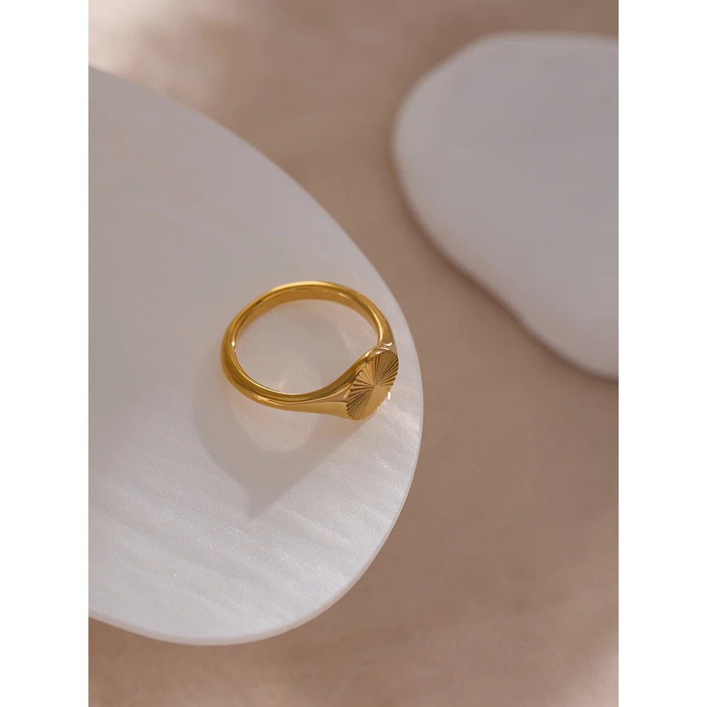 Geometric ring in gold-plated stainless steel.