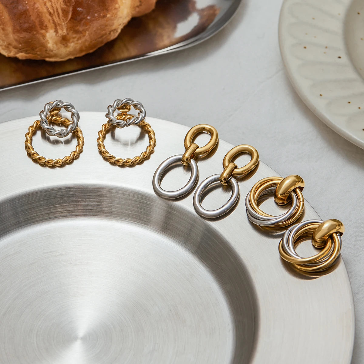 Two-Tone Knot Hoop Earrings — Stainless Steel · PS102