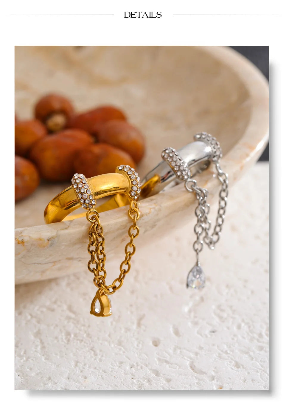Cubic zirconia geometric chain ring in 18K gold-plated stainless steel with cubic zirconia.