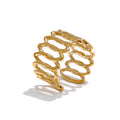 Geometric ring in gold-plated stainless steel.