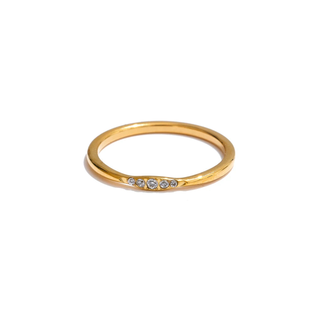 Cubic zirconia geometric ring in 18K gold-plated stainless steel with cubic zirconia.
