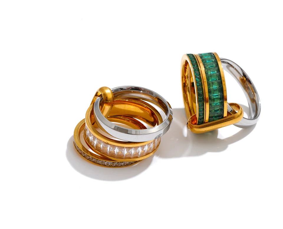 Cubic zirconia geometric layered ring in 18K gold-plated stainless steel with cubic zirconia.