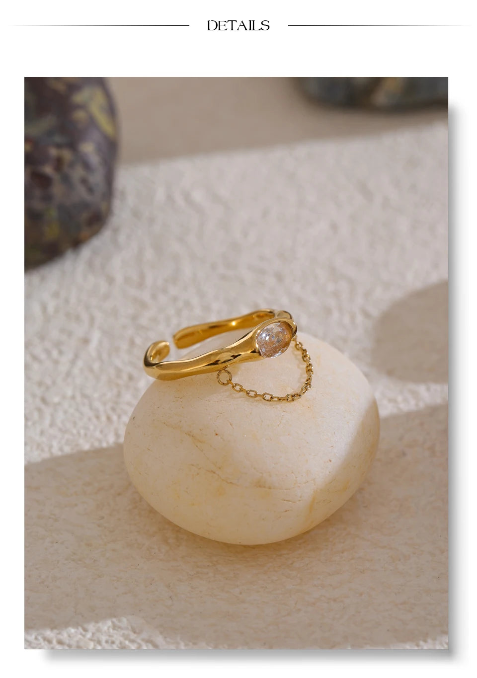 Cubic zirconia geometric chain ring in 18K gold-plated stainless steel with cubic zirconia.