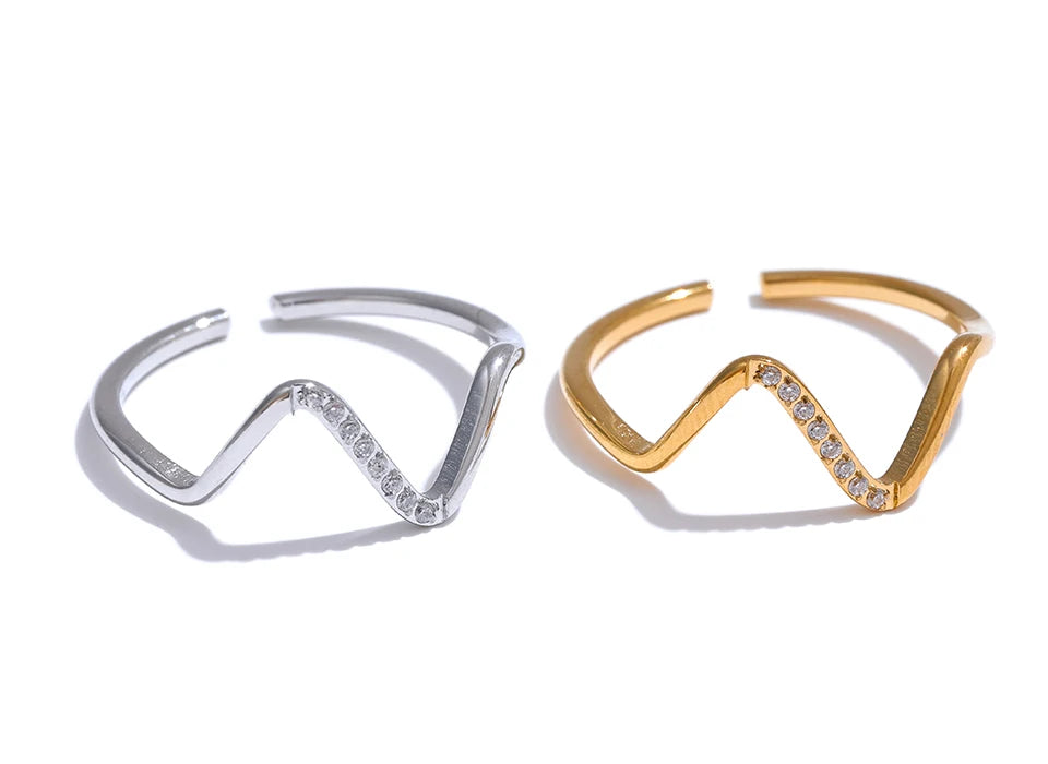 Cubic zirconia geometric ring in 18K gold-plated stainless steel with cubic zirconia.