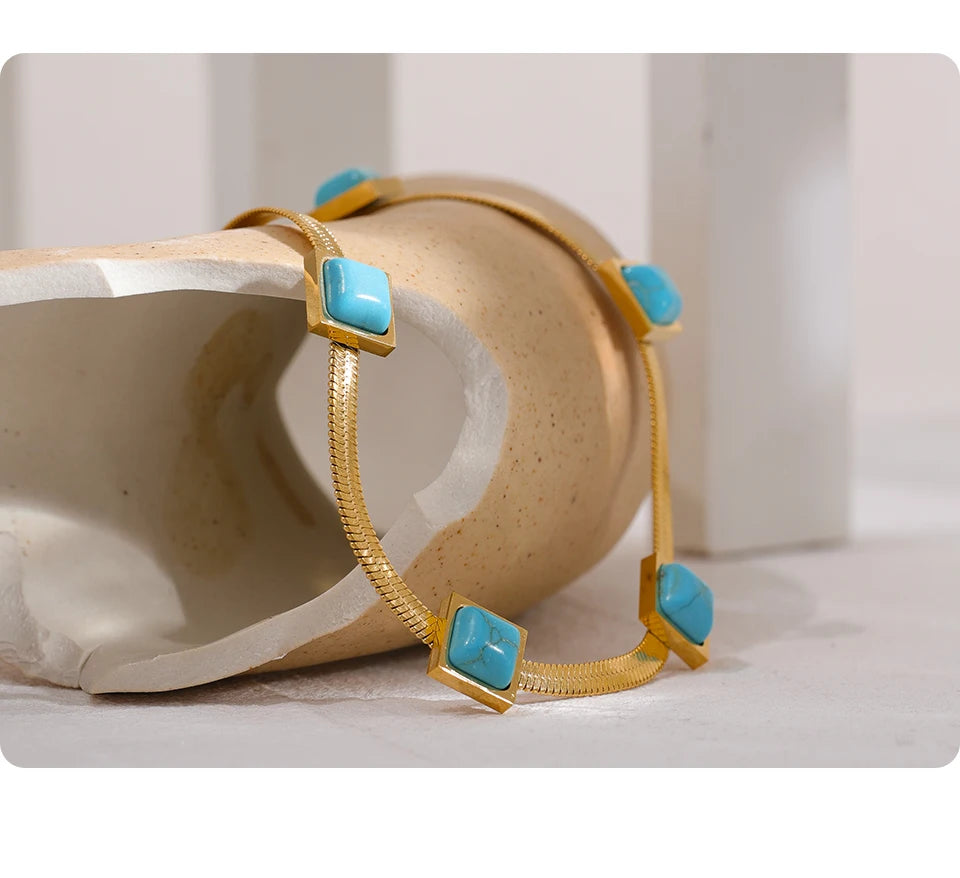 Blue natural stone snake necklace in gold-plated stainless steel with natural stone.