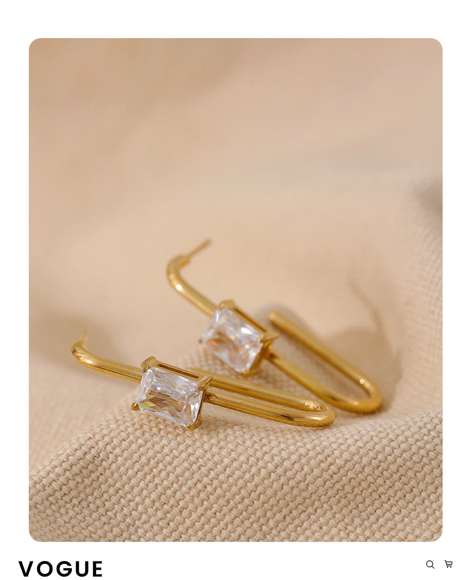 Black cubic zirconia geometric earrings in 18K gold-plated stainless steel with cubic zirconia.