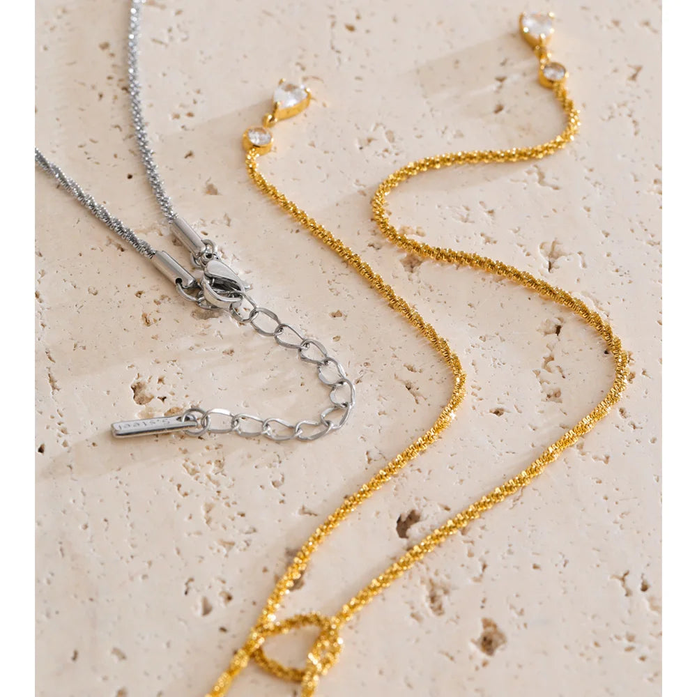 Cubic zirconia geometric chain necklace in gold-plated stainless steel with cubic zirconia.