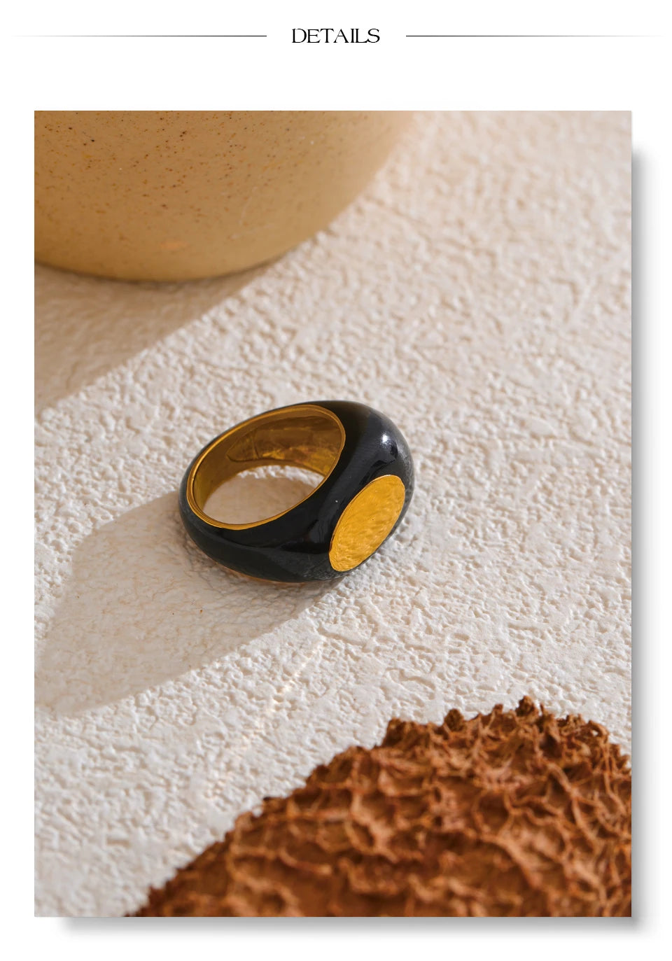 Black enamel geometric ring in gold-plated 316L stainless steel with enamel.