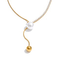Cubic zirconia pearl geometric necklace in gold-plated stainless steel with pearl and cubic zirconia.