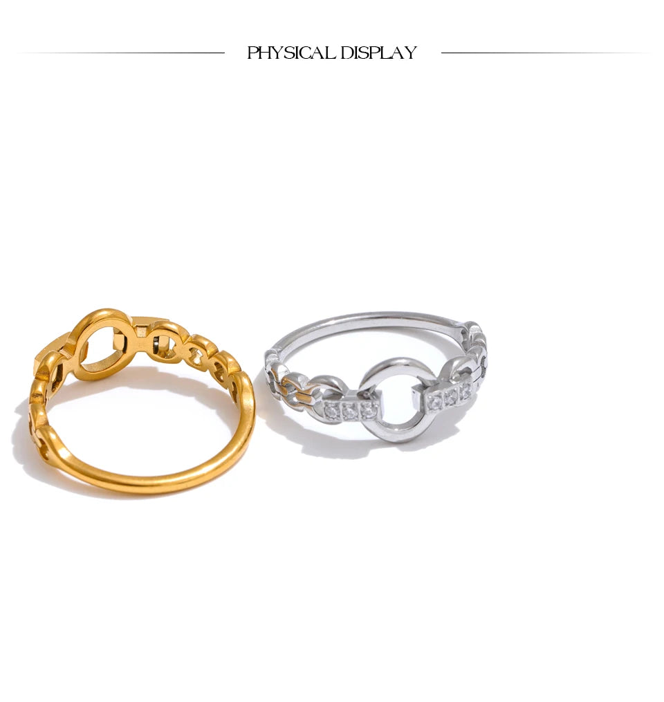 Cubic zirconia geometric ring in gold-plated stainless steel with cubic zirconia.