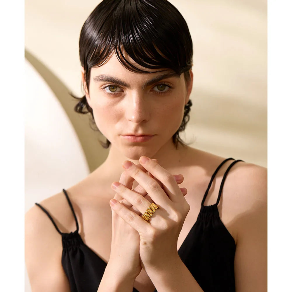 Geometric chain ring in gold-plated stainless steel.