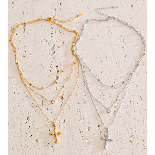 Cubic zirconia cross chain necklace in gold-plated stainless steel with cubic zirconia.