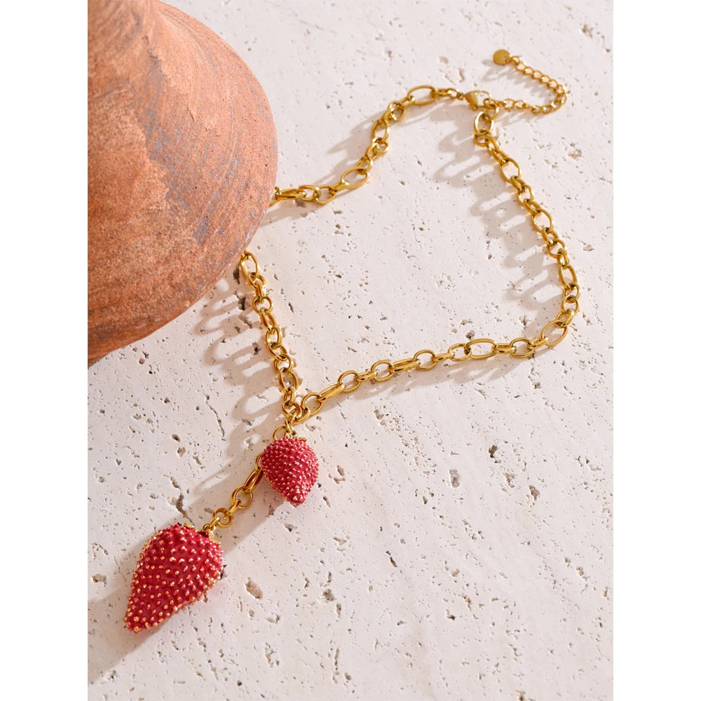 Red heart geometric necklace in gold-plated stainless steel.