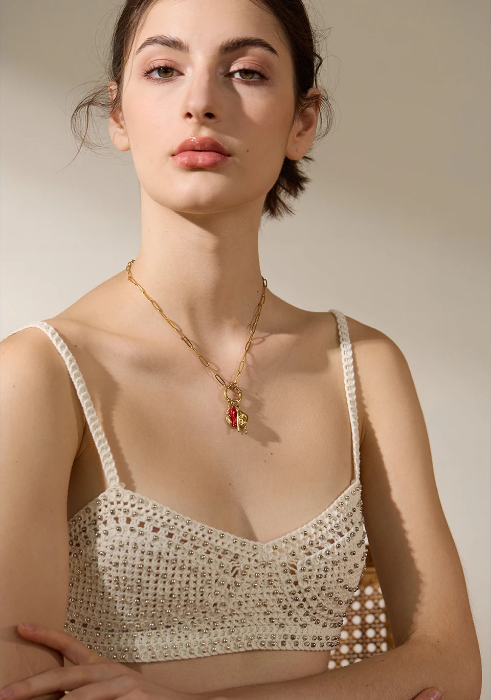 Red heart geometric necklace in gold-plated 316L stainless steel.