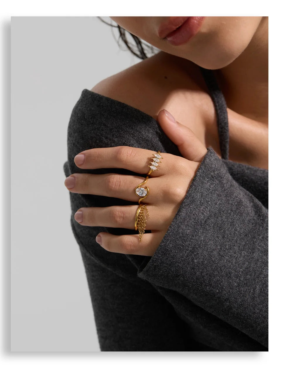 Cubic zirconia geometric ring in 18K gold-plated stainless steel with cubic zirconia.