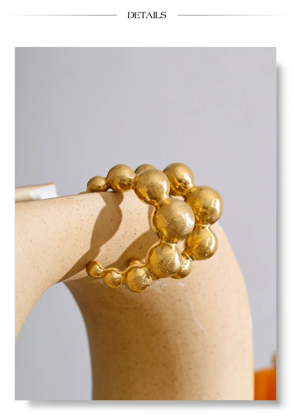 Beaded geometric earrings in gold-plated stainless steel.