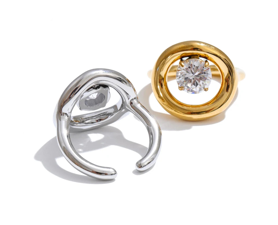 Cubic zirconia geometric ring in 18K gold-plated stainless steel with cubic zirconia.